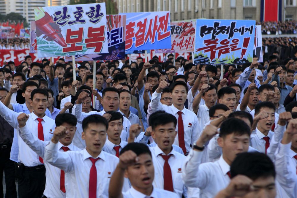 North Koreans gather at Kim Il Sung Square to attend a mass rally against America on Saturday, Sept. 23, 2017, in Pyongyang, North Korea, a day after the country's leader issued a rare statement attacking Donald Trump. The sign on the left reads &quot;decisive revenge&quot; and the sign on the right reads &quot;death to the American imperialists.&quot; (Jon Chol Jin/AP)