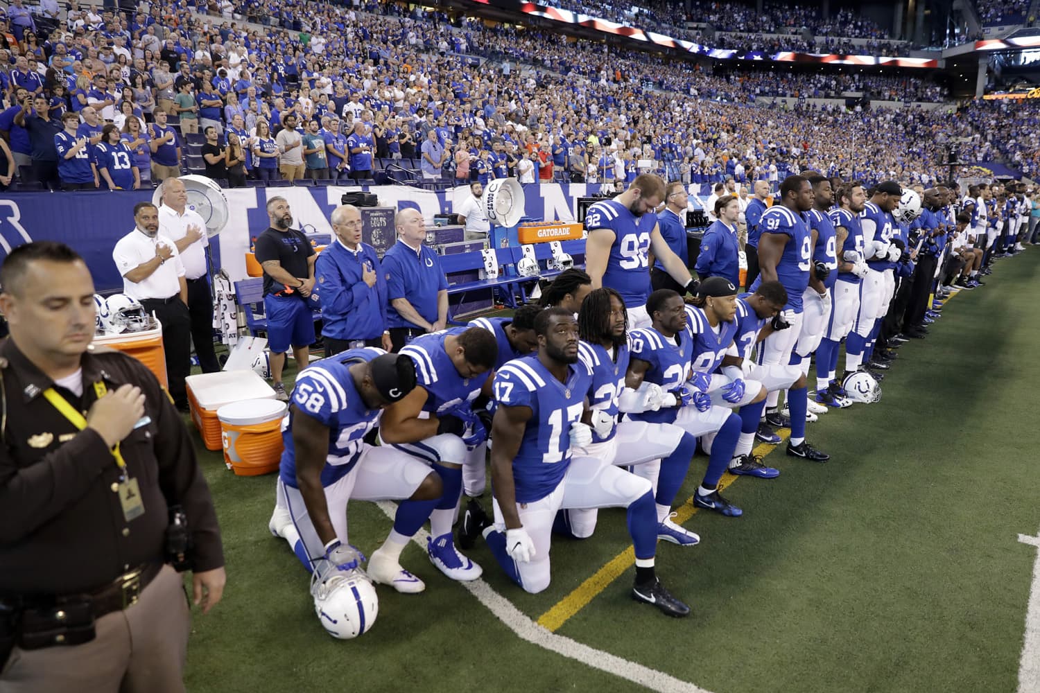 Members of the Indianapolis Colts take a knee during the nation anthem before an NFL football game against the Cleveland Browns in Indianapolis, Sunday, Sept. 24, 2017. (Darron Cummings/AP)