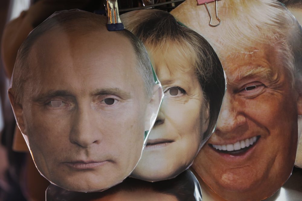 Face masks depicting Russian President Vladimir Putin, German chancellor Angela Merkel and US President Donald Trump, on display for sale at a street souvenir shop in St.Petersburg, Russia, Monday, Sept. 25, 2017. (Dmitri Lovetsky/AP)