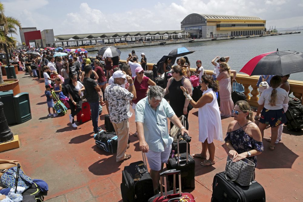 Thousands of people evacuating Puerto Rico after Hurricane Maria line up to get on a ship on Thursday. (Gerald Herbert/AP)