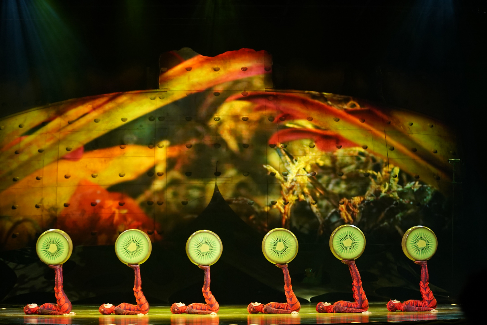 Dressed as the insects who people "OVO," Cirque du Soleil performers juggle "kiwi-fruit" instruments. (Courtesy Cirque du Soleil)