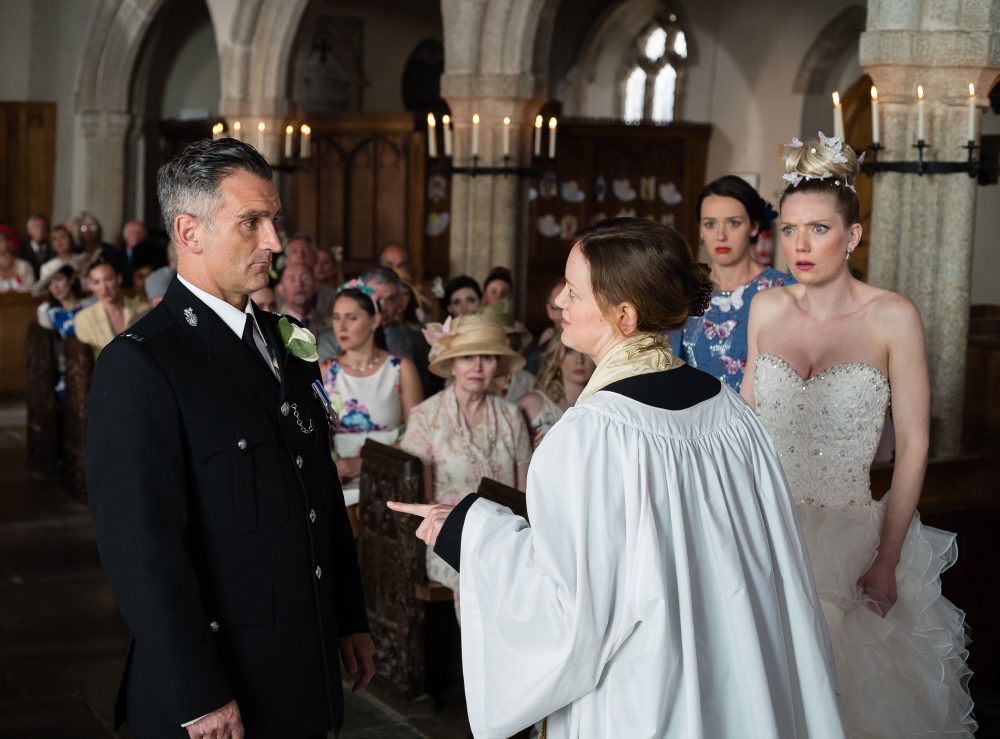 PC Penhale (John Marquez) prepares to marry Janice (Robyn Addison) in &quot;Doc Martin.&quot; (Courtesy of AcornTV)