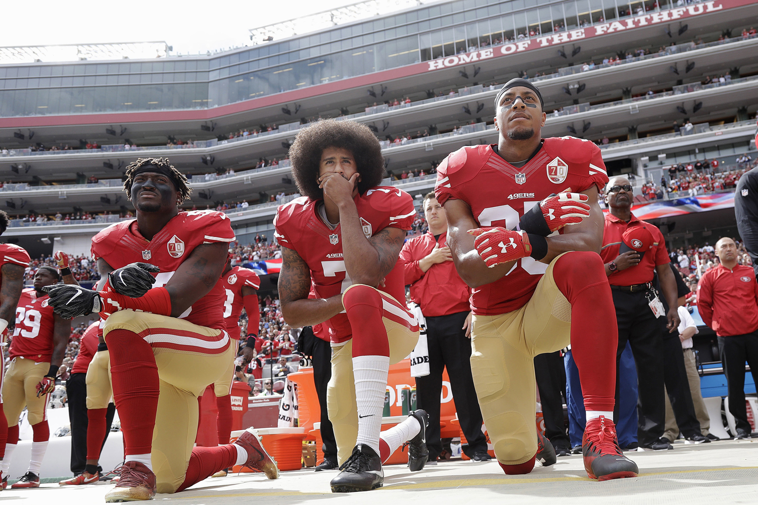 In this Oct. 2, 2016 file photo, from left, San Francisco 49ers outside linebacker Eli Harold, quarterback Colin Kaepernick and safety Eric Reid kneel in protest during the national anthem before an NFL football game against the Dallas Cowboys in Santa Clara, Calif. (Marcio Jose Sanchez, AP)