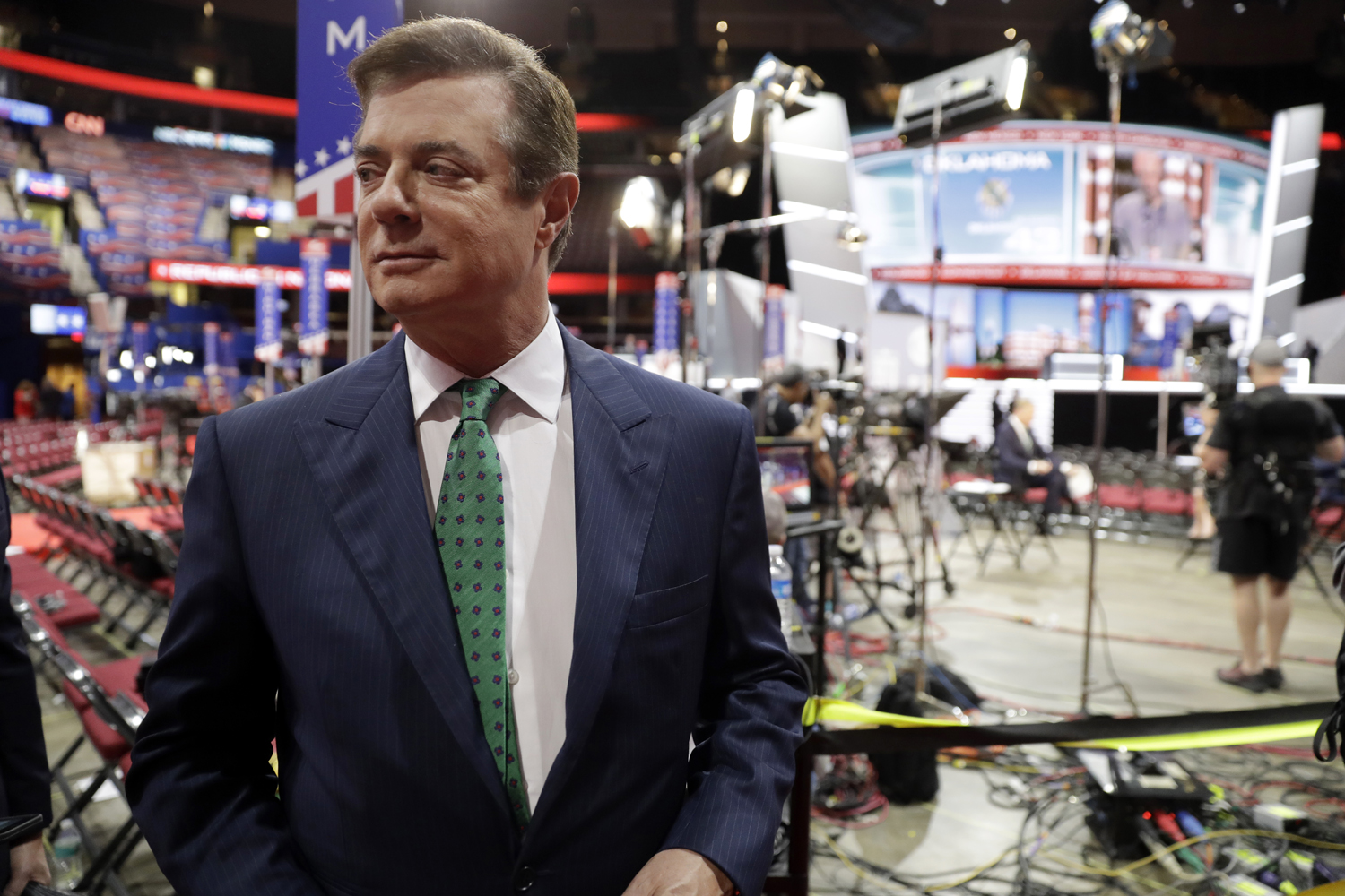 In this photo taken July 17, 2016, Paul Manafort talks to reporters on the floor of the Republican National Convention at Quicken Loans Arena in Cleveland. Lately, special prosecutor Robert Mueller has been ratcheting up pressure on Manafort. (Matt Rourke/AP)