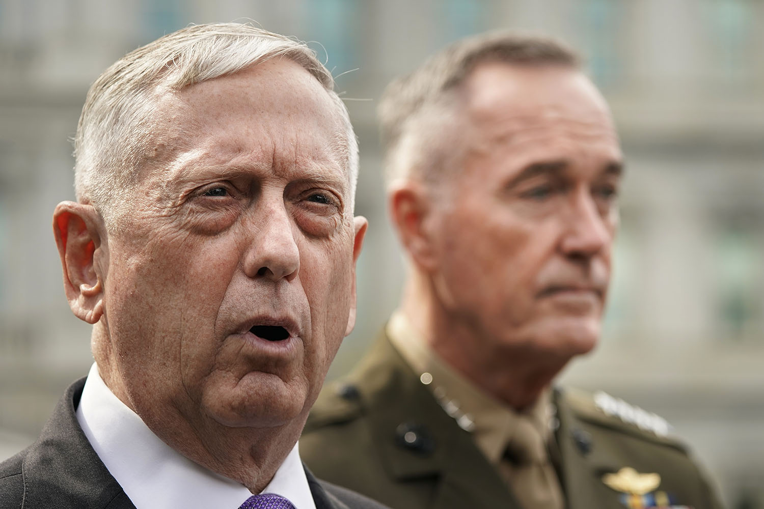 Defense Secretary Jim Mattis, left, accompanied by Joint Chiefs Chairman Gen. Joseph Dunford, right, speaks to members of the media outside the West Wing of the White House in Washington, Sunday, Sept. 3 regarding the escalating crisis in North Korea's nuclear threats. (Pablo Martinez Monsivais/AP)