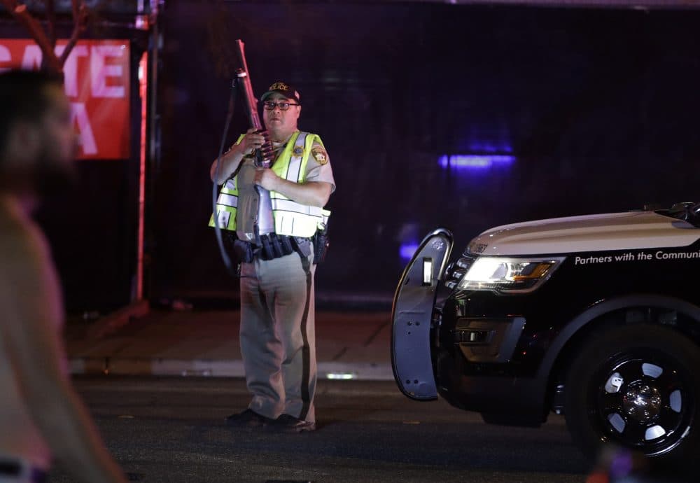 A police officer stands at the scene. (John Locher/AP)