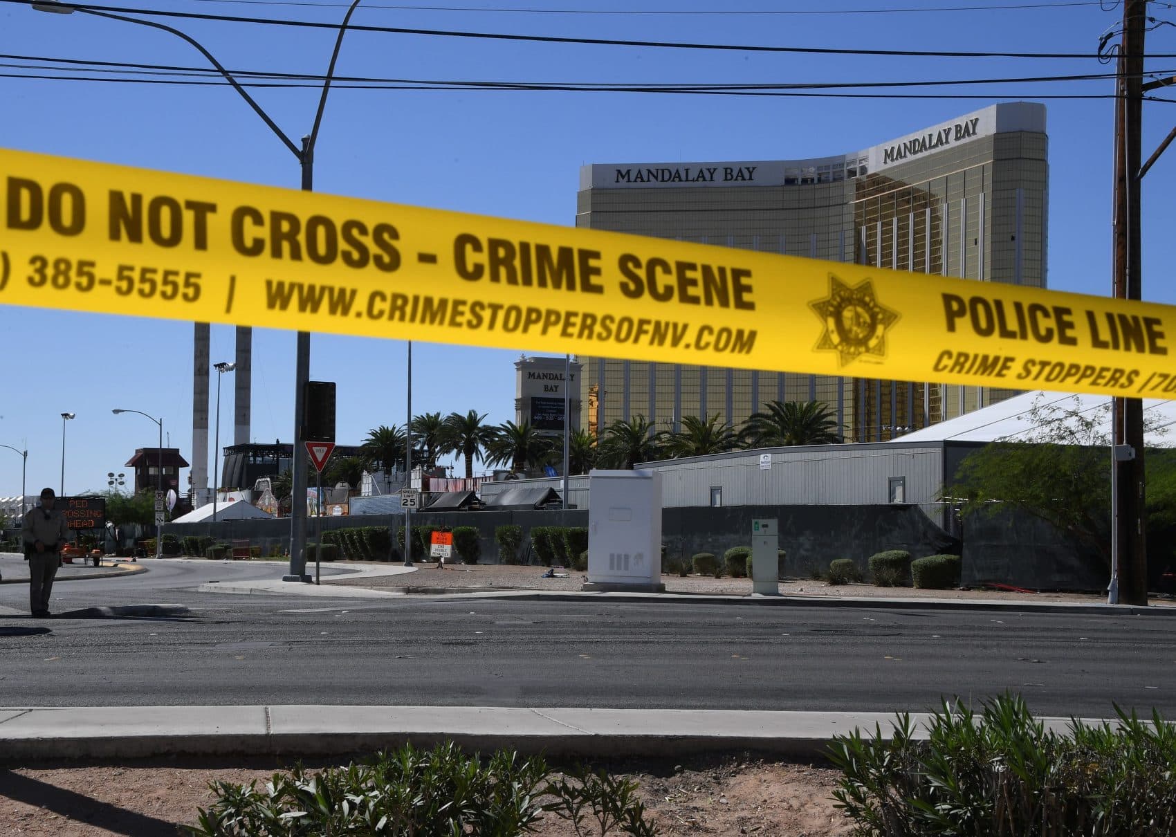 The damaged windows on the 32nd-floor room that was used by the shooter in the Mandalay Hotel, and the Route 91 Harvest Festival venue in Las Vegas on Oct. 2, 2017. (Mark Ralston/AFP/Getty Images)