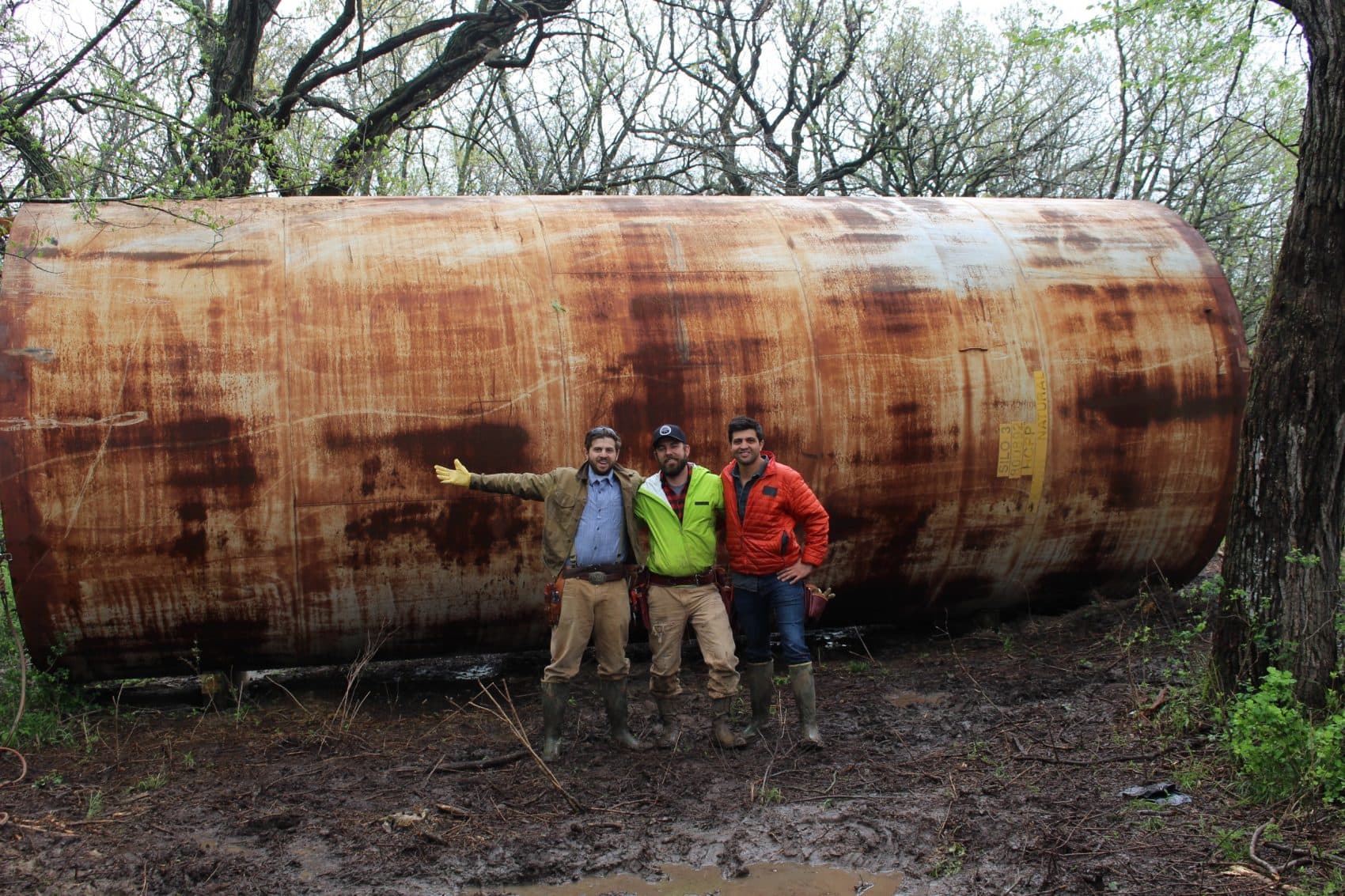 Rehan Nana (left), Kyle Davis (center) and Taimoor Nana, hosts of "You Can't Turn That Into A House," in front of an old grain silo. (Courtesy A+E Networks)