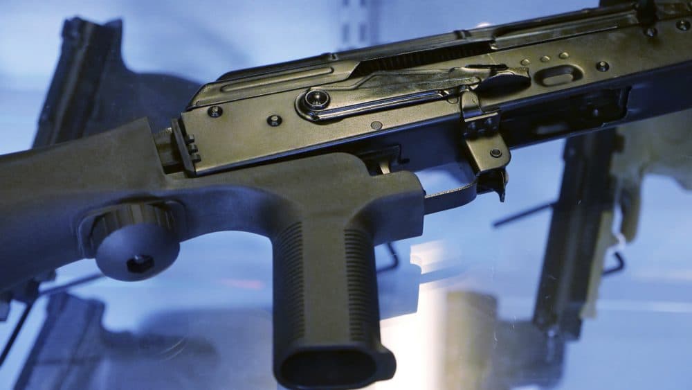 In this Oct. 4, 2017, photo, a device called a &quot;bump stock&quot; is attached to a semi-automatic rifle at the Gun Vault store and shooting range in South Jordan, Utah. (Rick Bowmer/AP)