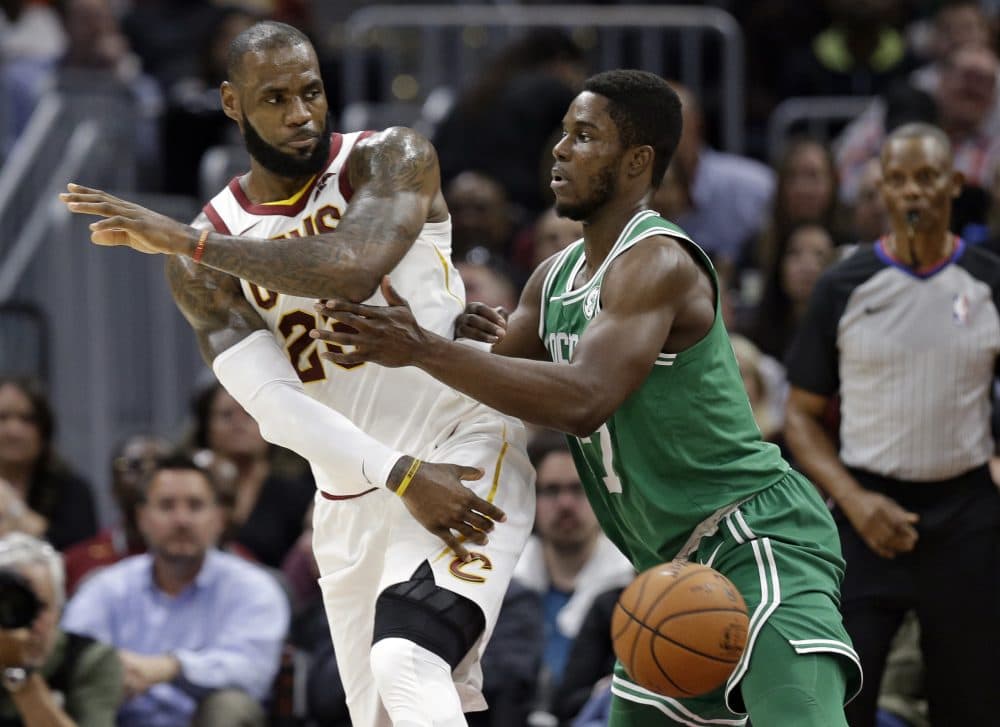 Cleveland Cavaliers' LeBron James, left, passes against Boston Celtics' Semi Ojeleye in the first half. (Tony Dejak/AP)