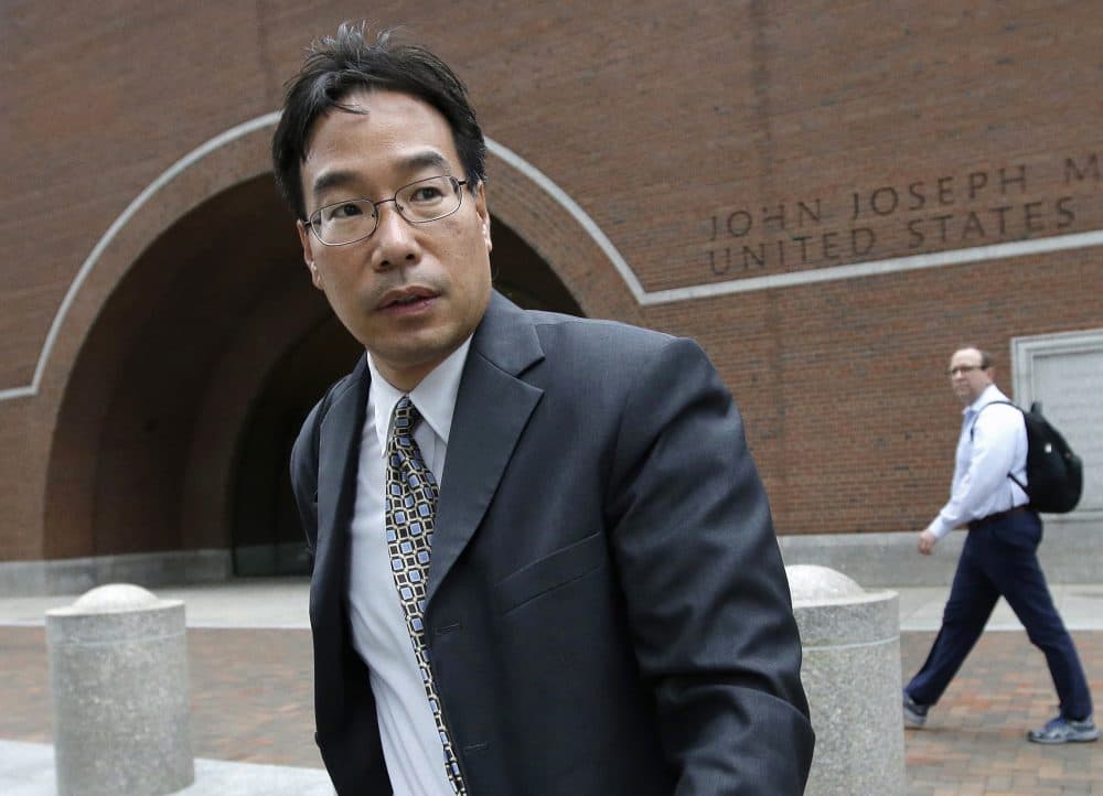 Glenn Chin, supervisory pharmacist at the now-closed New England Compounding Center, leaves federal court after attending the first day of his trial in Boston in Sept. He was found guilty of dozens of counts but acquitted of 25 counts of second-degree murder. (Steven Senne/AP)