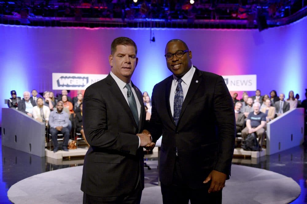 Boston Mayor Marty Walsh, left, and City Councilor Tito Jackson, right, shake hands after a mayoral debate at the WGBH in Boston on Tuesday. (Meredith Nierman/WGBH News via AP, Pool)