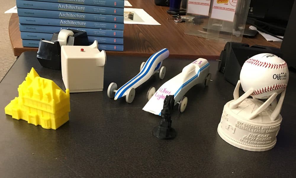 Items made by Blackstone Valley Tech students using 3D printers. (Lynn Jolicoeur/WBUR)