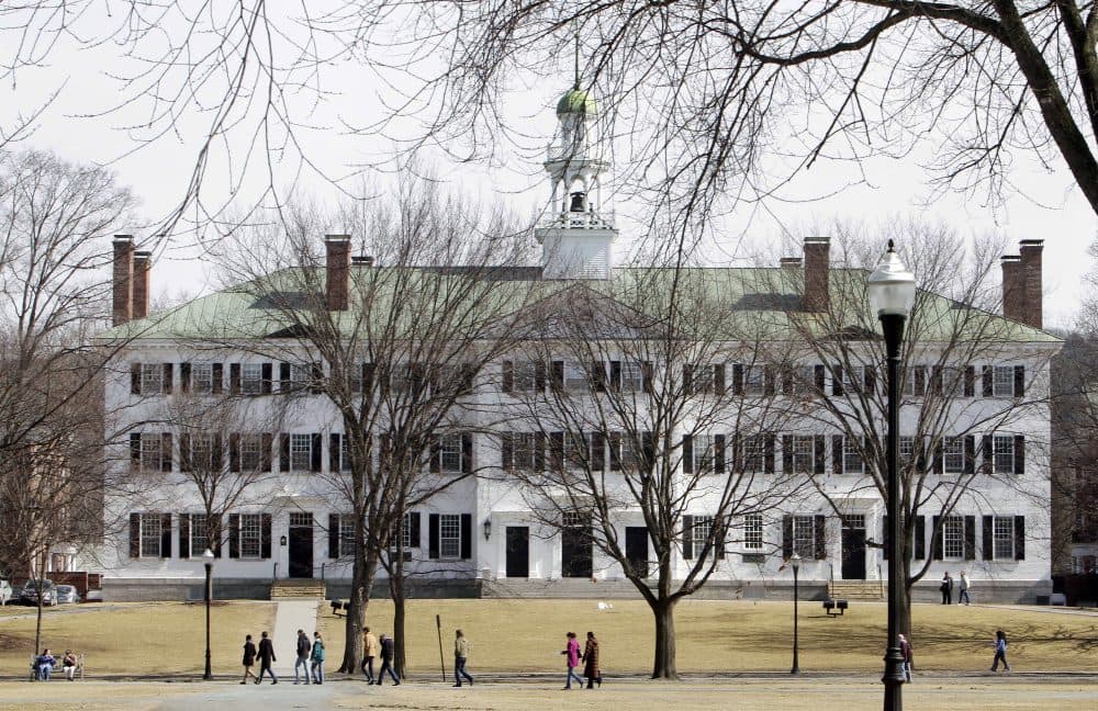 Students walk across the Dartmouth College campus green in Hanover, N.H. in 2012. (Jim Cole/AP file)