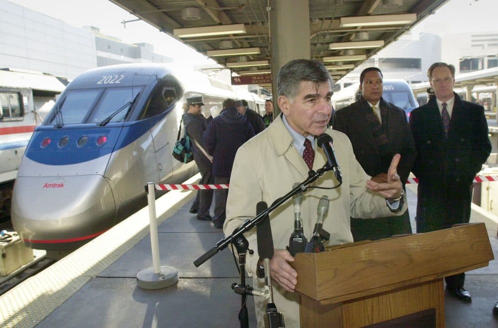 Former Gov. Michael Dukakis addresses reporters on Dec. 10, 2001 at South Station in Boston. (Lawrence Jackson/AP)