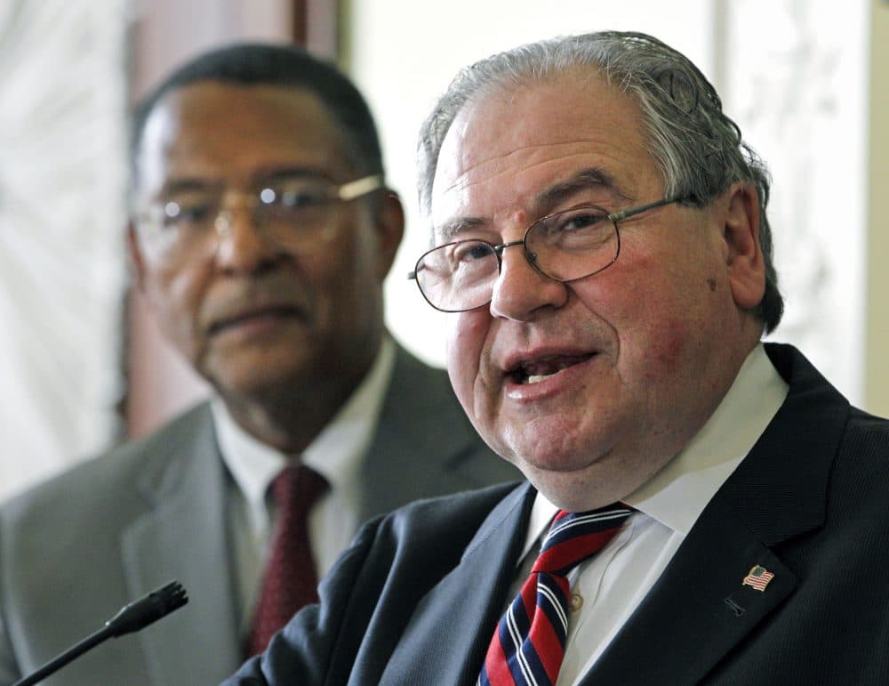 House Speaker Robert DeLeo speaks as then-Supreme Judicial Court Chief Justice Roderick Ireland listens in this 2011 file photo. Ireland is now advising DeLeo's House on criminal justice legislation. (Elise Amendola/AP)