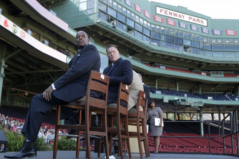 Cedric Maxwell, former Boston Celtics player, left, Bob Sweeney, executive director of the Boston Bruins Foundation, second from left, and Tanisha Sullivan, NAACP Boston branch president, right, look toward a video screen during a panel discussion held to introduce an initiative called &quot;Take The Lead,&quot; Thursday, Sept. 28, 2017, at Fenway Park in Boston. The Red Sox, Patriots, Celtics, Bruins, and Revolution are joining a project they're calling &quot;Take the Lead&quot; that was unveiled Thursday. (Steven Senne/AP)