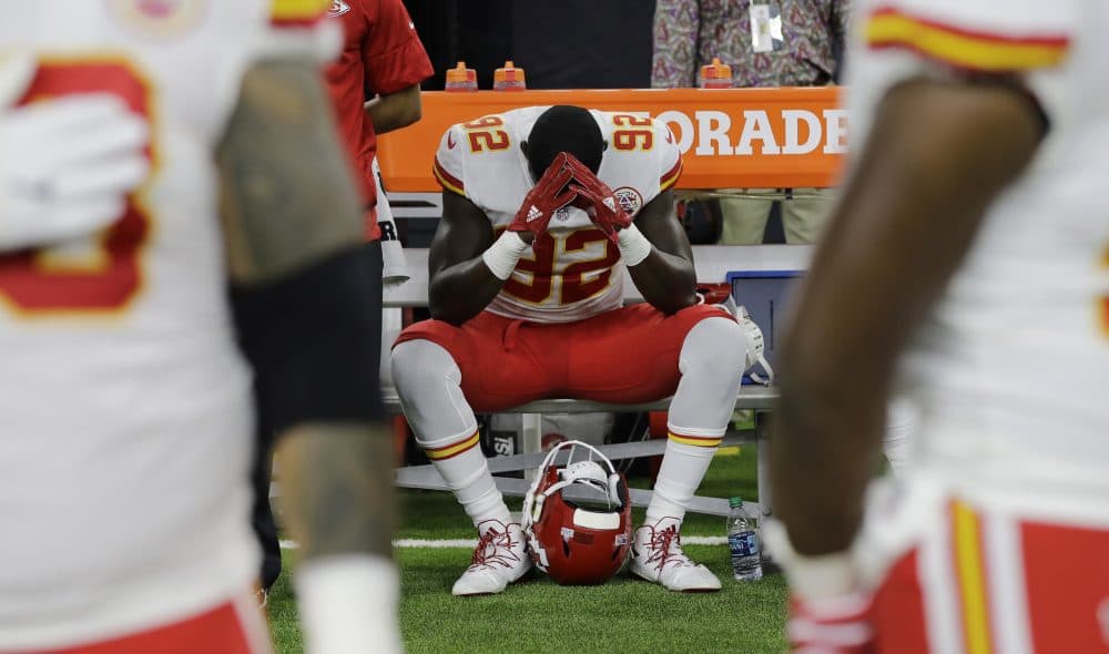 Kansas City Chiefs linebacker Tanoh Kpassagnon (92) sits on the bench during the national anthem before an NFL football game against the Houston Texans, Sunday, Oct. 8, 2017, in Houston. (David J. Phillip/AP)