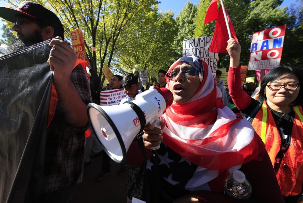 American Hoshneara Begum, center, Bangladeshi descent, leads chant of slogans against what they call a &quot;Muslim ban&quot; as she and others march from Lafayette Square to the Trump International Hotel in Washington, Wednesday, Oct. 18, 2017. (Manuel Balce Ceneta/AP)