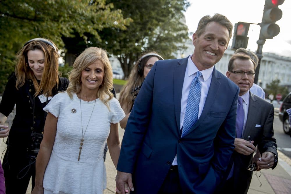 Sen. Jeff Flake, R-Ariz., accompanied by his wife Cheryl, leaves the Capitol in Washington, Tuesday, Oct. 24, 2017, after announcing he won't seek re-election in 2018. (Andrew Harnik/AP)
