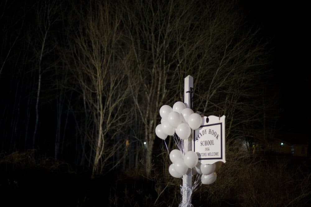 White balloons decorate the sign for the Sandy Hook Elementary School, on Dec. 15, 2012. (David Goldman/AP)