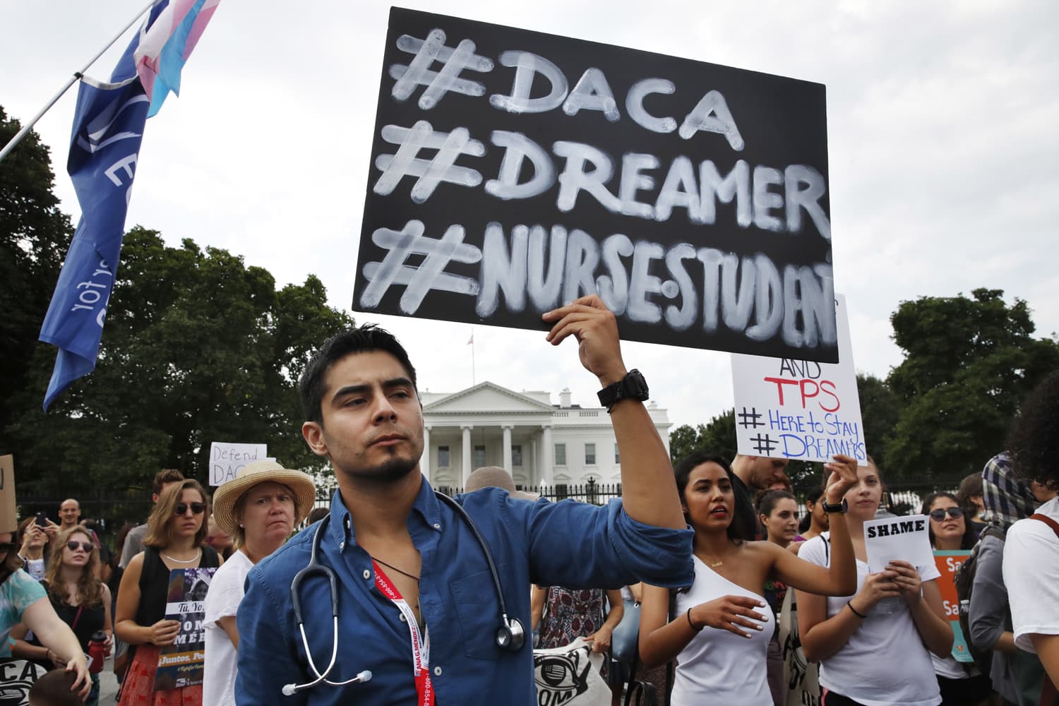 Carlos Esteban, 31, of Woodbridge, Va., a nursing student and recipient of Deferred Action for Childhood Arrivals, known as DACA, rallies with others in support of DACA outside of the White House, in Washington on Sept. 5. (Jacquelyn Martin/AP)