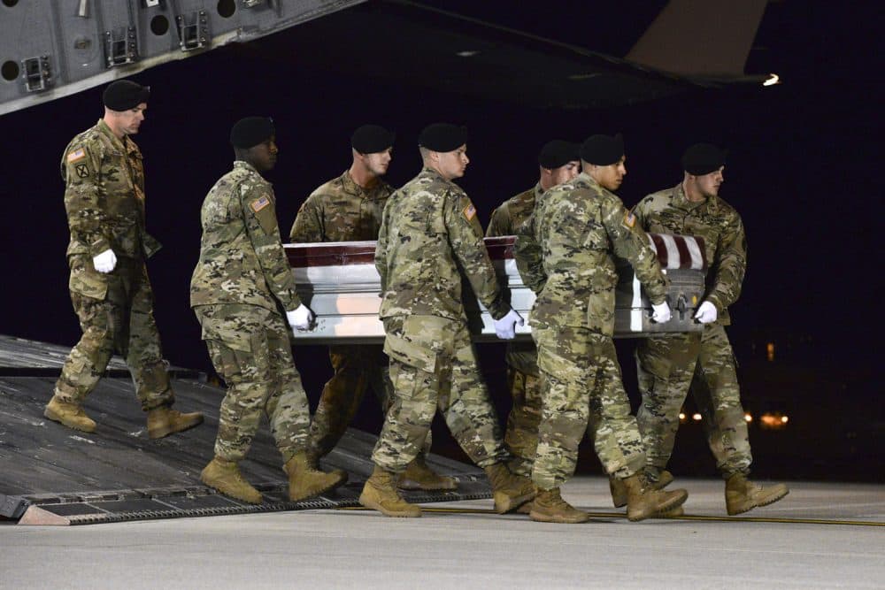A team transfers the remains of Army Staff Sgt. Dustin Wright upon arrival at Dover Air Force Base, Del. (Staff Sgt. Aaron J. Jenne/U.S. Air Force via AP)