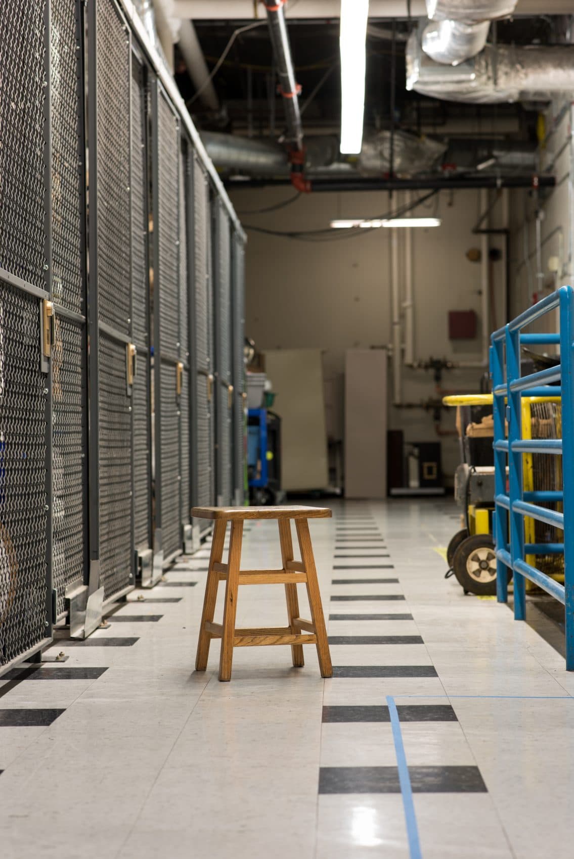 A blue line of tape leads participants in the "Waiting Rooms" installation behind the scenes of the Museum of Science building. (Courtesy C.M./Museum of Science)
