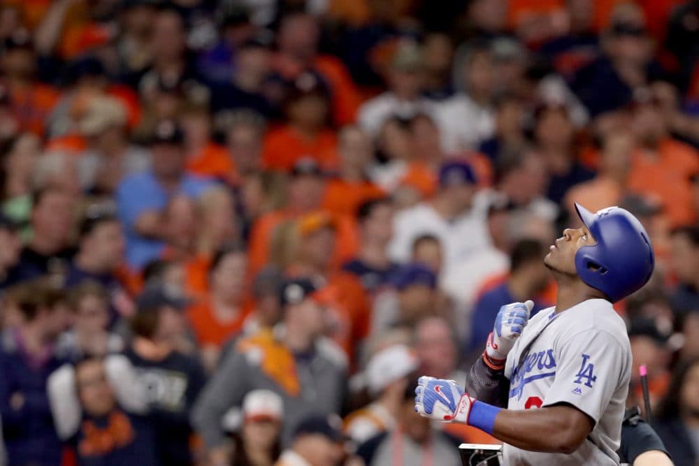 During Game 5 of the World Series, Yasiel Puig (front) hit a home run into the bleachers of Minute Maid Park in Houston. The ball was quickly thrown right back. (Christian Petersen/Getty Images)