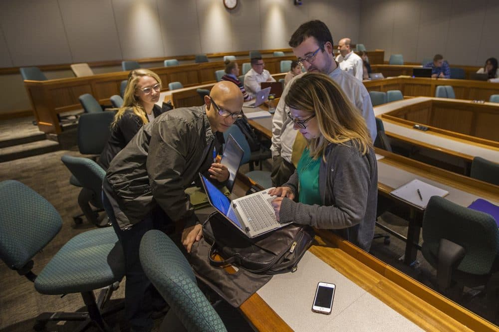 Students in Gabe Teninbaum’s class work on an app to collect information from people affected by the recent Equifax breach. Teh app is supposed to automatically identify a claim as actual or fake to prioritize each one. (Jesse Costa/WBUR)