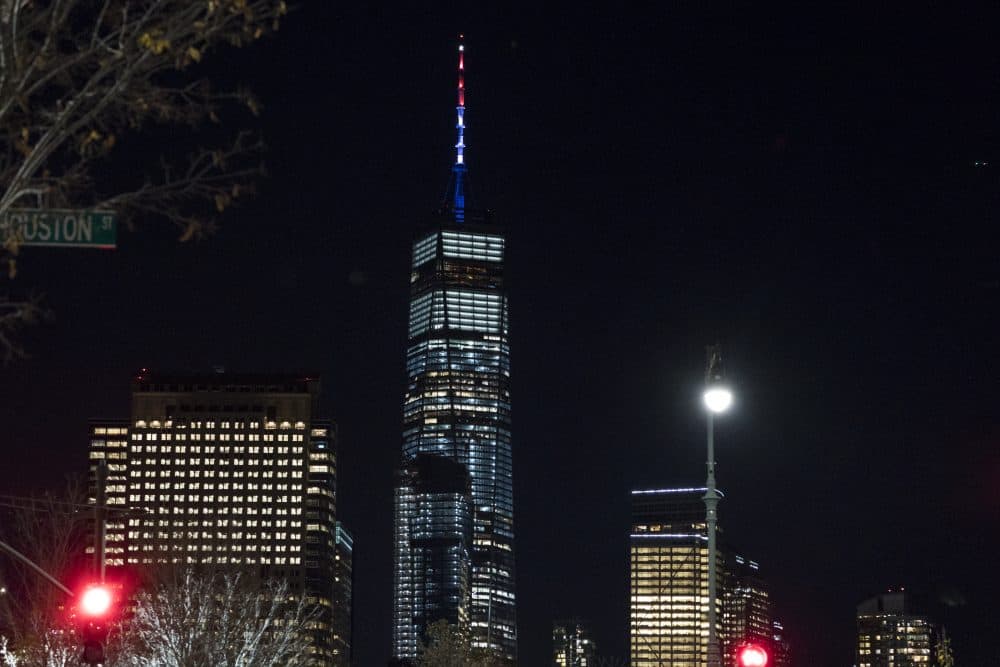 As ordered by New York Gov. Andrew Cuomo, the spire of One World Trade Center is illuminated in red, white and blue following a deadly rampage down a bike path not far from the building on Tuesday. (Craig Ruttle/AP)