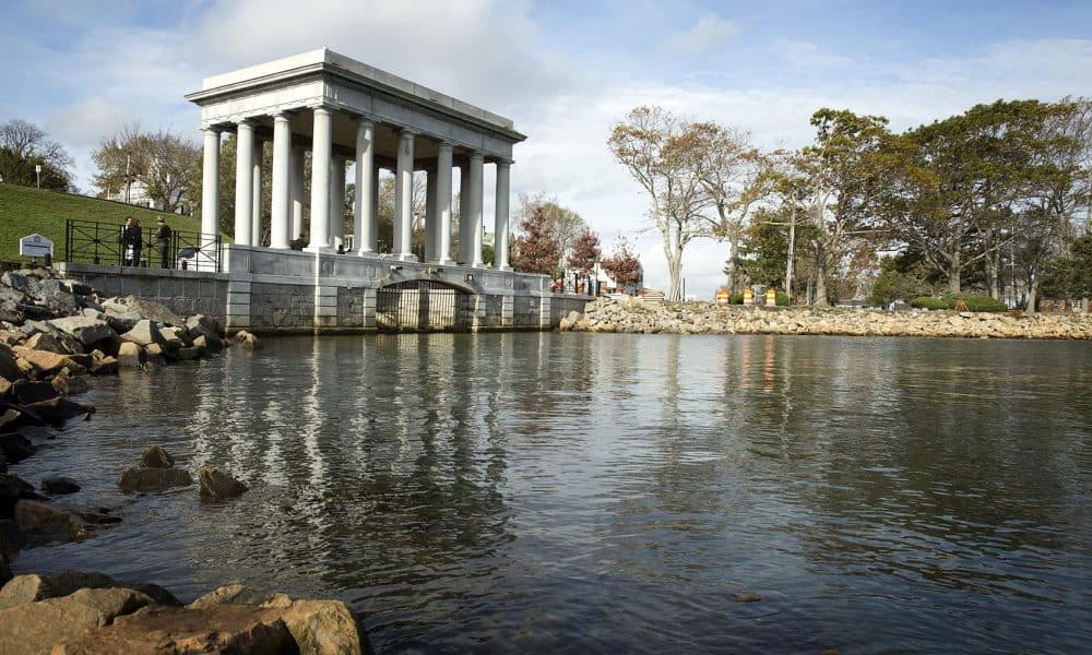 Plymouth Rock lies at the water's edge in this monument at Pilgrim Memorial State Park in Plymouth, Mass. (Robin Lubbock/WBUR)