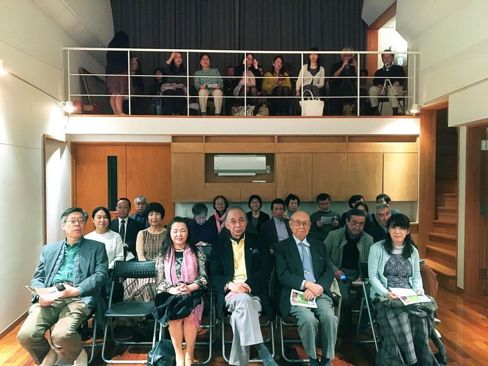 The audience at Suzuki's home in Ishinomaki. (Andrea Shea/WBUR)