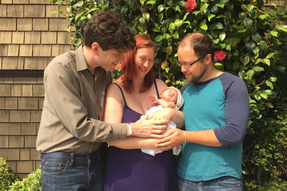 David Jay (left), Avary Kent (center) and Zeke Hausfather with baby Octavia. (Courtesy David Jay)