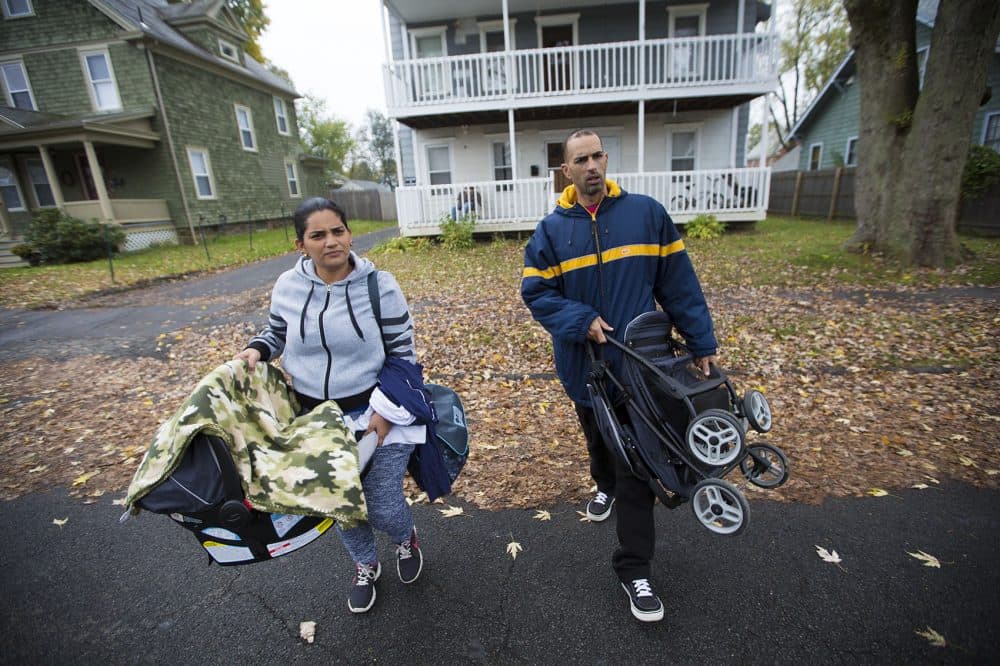 Alicea and Santini walk outside their apartment in Greenfield on their way to Enlace. (Jesse Costa/WBUR)