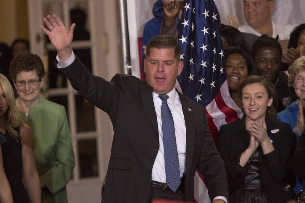 Boston Mayor Marty Walsh waves to the crowd as he arrives on stage to deliver his victory speech. (Jesse Costa/WBUR)