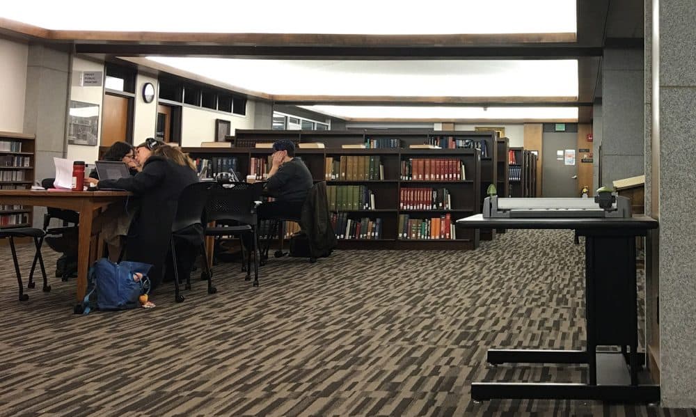 Students study inside Amherst College's Frost Library. (Max Larkin/WBUR)