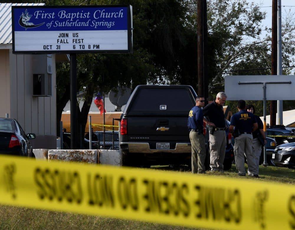 FBI agents search for clues at the entrance to the First Baptist Church, after a mass shooting that killed 26 people in Sutherland Springs, Texas, on Nov. 6, 2017. (Mark Ralston/AFP/Getty Images)