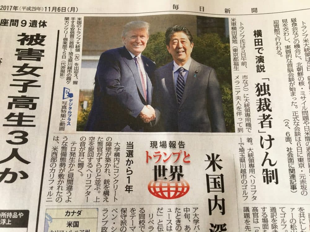 A photo of President Trump with Japanese Prime Minister Shinzō Abe in Monday's newspaper. (Andrea Shea/WBUR)