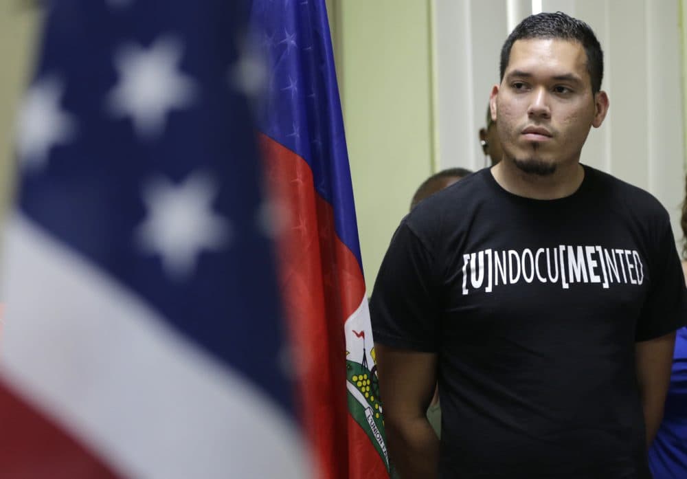 Julio Calderon, 28, an undocumented immigrant from Honduras, listens after speaking in favor of renewing Temporary Protected Status (TPS) for immigrants from Central America and Haiti now living in the United States, during a news conference Monday, Nov. 6, 2017, in Miami. The Department of Homeland Security is expected to rule soon on whether or not to renew the protected status. (Lynne Sladky/AP)