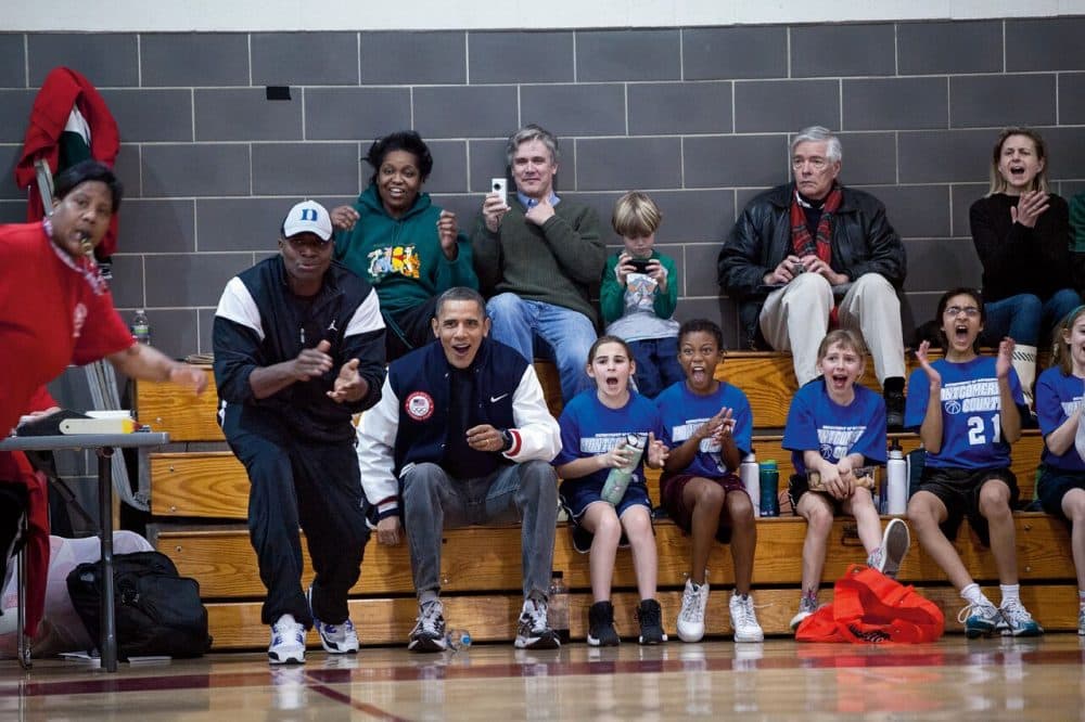 Obama reacts from the bench during his daughter Sasha's basketball game. The two coaches for her team couldn't make the game, so Obama and Reggie Love filled in. (Courtesy of Little, Brown and Company/Pete Souza)