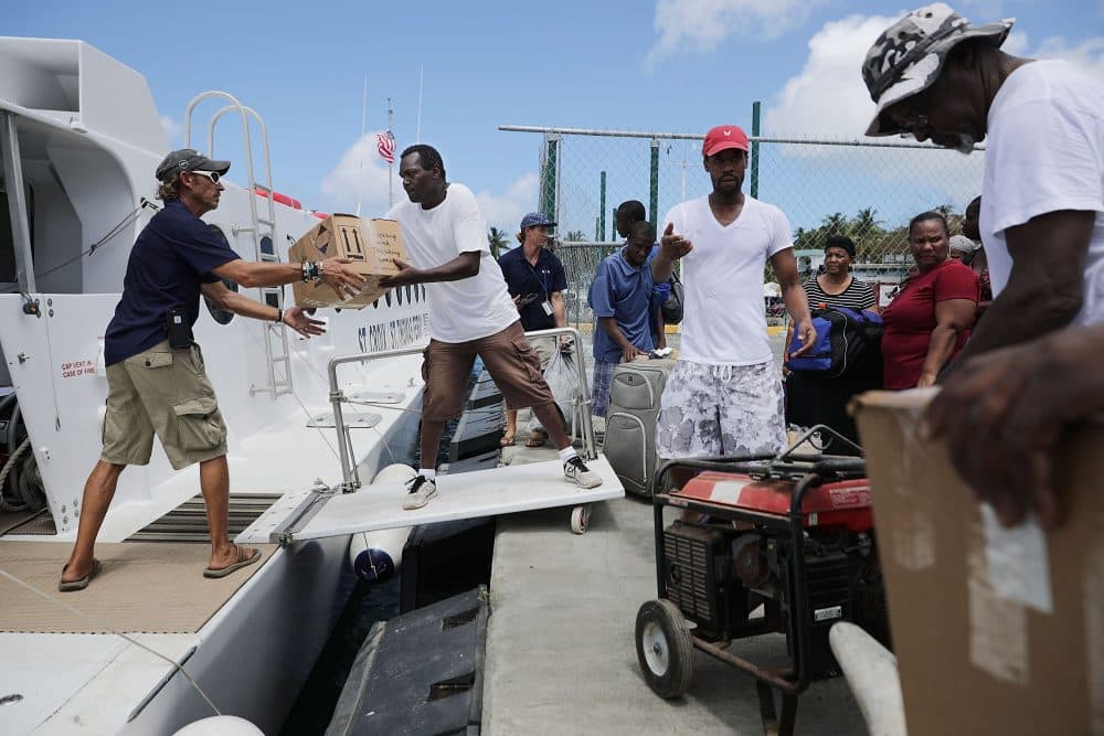 Crew and volunteers load the Queen Elizabeth IV ferry with supplies and passengers for St. Thomas more than a week after Hurricane Irma made landfall Sept. 17, 2017 in Christiansted, St. Croix, U.S. Virgin Islands. (Chip Somodevilla/Getty Images)