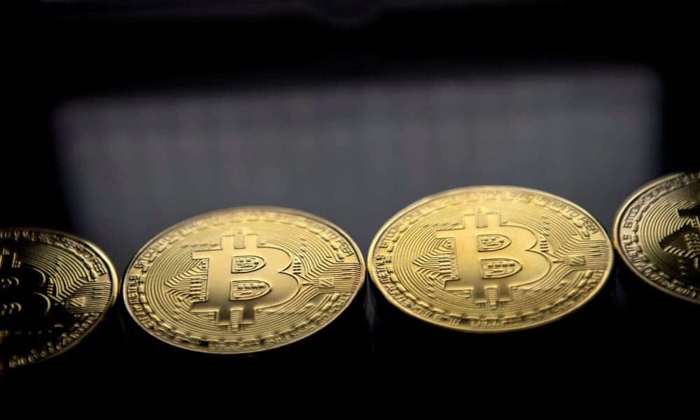 Gold-plated souvenir Bitcoin coins are arranged for a photograph on Nov. 20, 2017. (Justin Tallis/AFP/Getty Images)