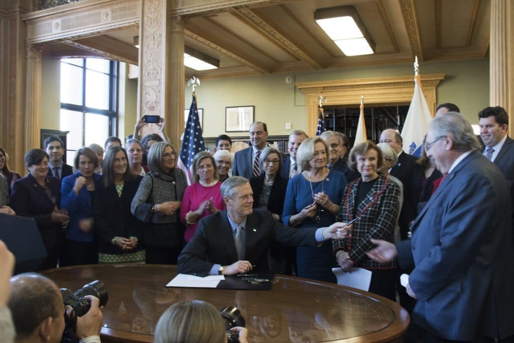 Gov. Charlie Baker signs the ACCESS bill at the State House Monday. (Courtesy of the governor's office)