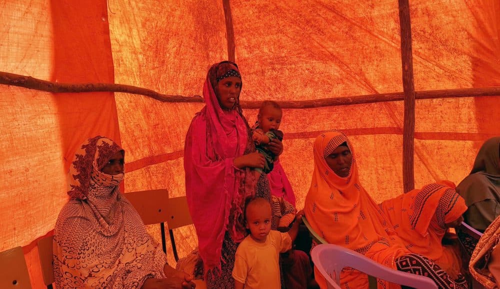In this photo taken Sunday, Sept. 3, 2017, Ethiopian women wait in a tent to receive food aid due to drought conditions in the Danan district of the Somali region of Ethiopia, which hasn't seen significant amounts of rain in the past three years. Despite economic growth in the past decade that has made Ethiopia one of Africa's fastest-developing countries, rural areas are suffering as the nation faces its worst drought in years. (Elias Meseret/AP)