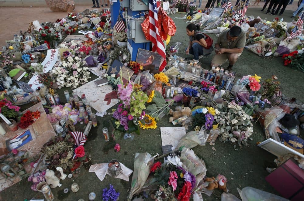 People visit a makeshift memorial for victims of the mass shooting in Las Vegas, Monday, Oct. 16, 2017, in Las Vegas. (John Locher/AP)
