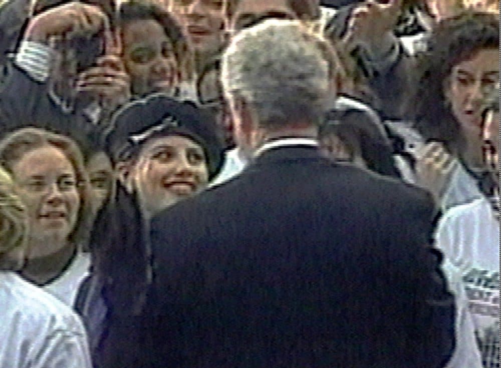 In this image taken from video, Monica Lewinsky embraces President Bill Clinton as he greeted well-wishers at a White House lawn party in Washington Nov. 6, 1996. (AP/APTV)