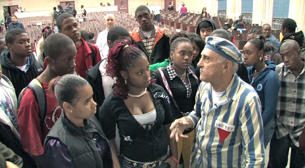 Steve Ross speaking with students at Jeremiah E. Burke High School. (Courtesy, Many Hats Productions)