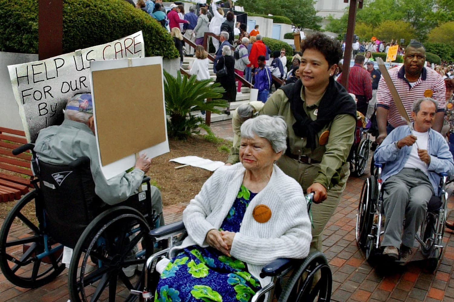 Elderly citizens in wheelchairs head toward the Capitol as long-term care residents, family and caregivers rally on the Capitol steps for litigation reform for eldercare facilities Wednesday, March 28, 2001, in Tallahassee, Fla. (Mark Foley/AP)