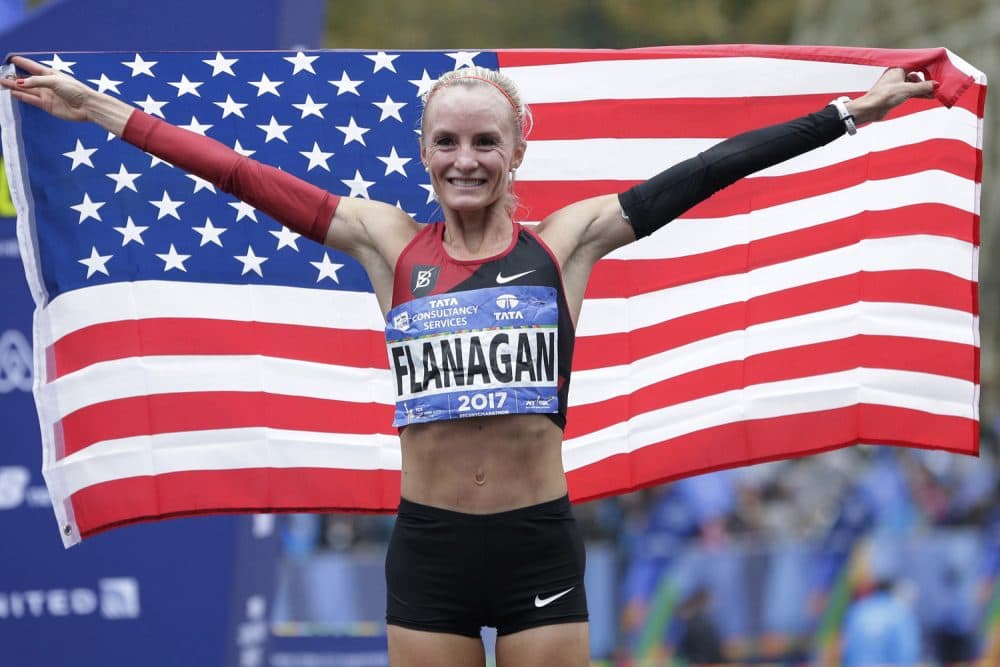 Shalane Flanagan of the United States poses for pictures after crossing the finish line first in the women's division of the New York City Marathon in New York, Sunday, Nov. 5, 2017. She is running the Boston Marathon on Monday. (Seth Wenig/AP)